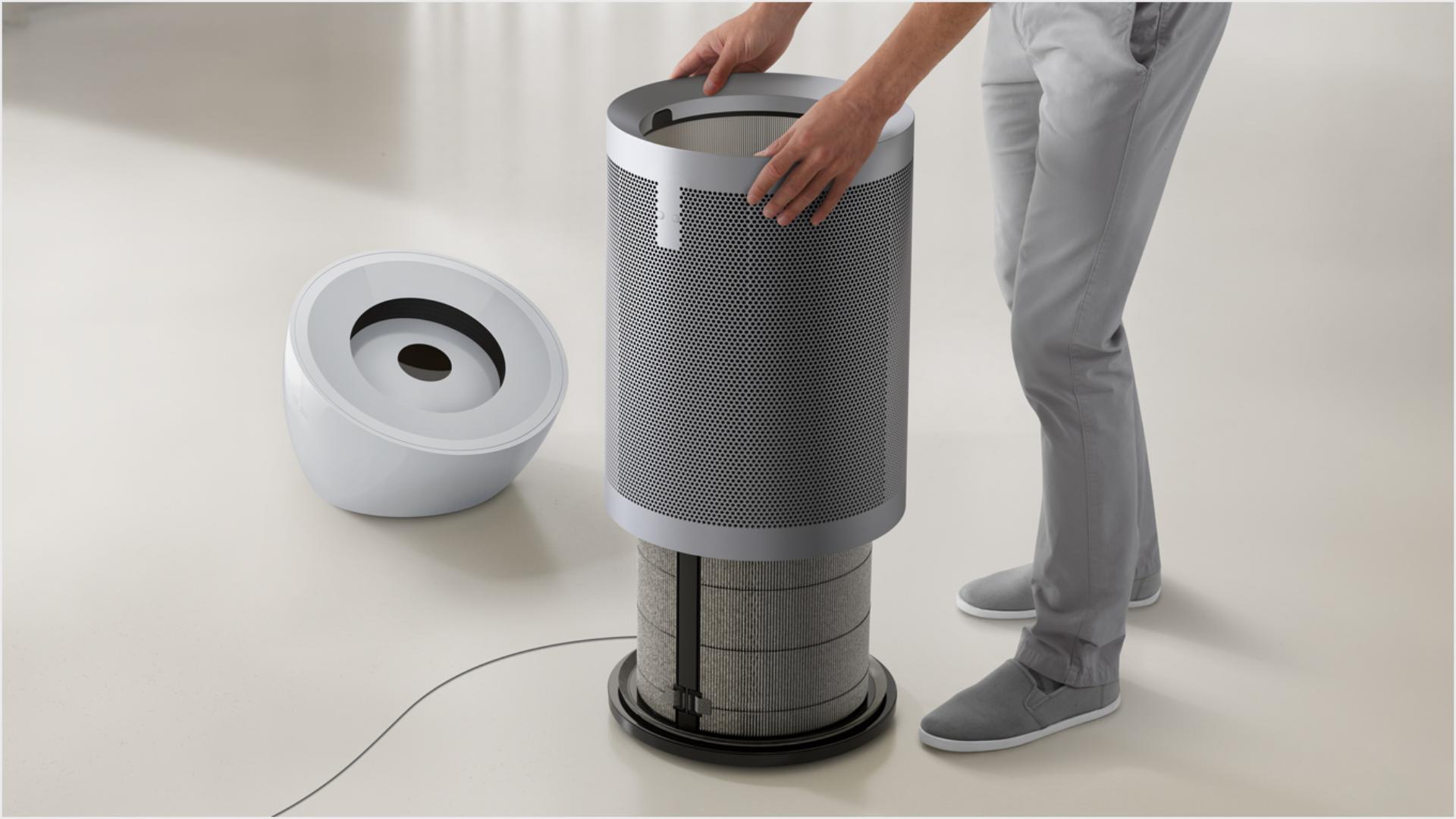 A person opening the Dyson Purifier Big+Quiet to access the filter.