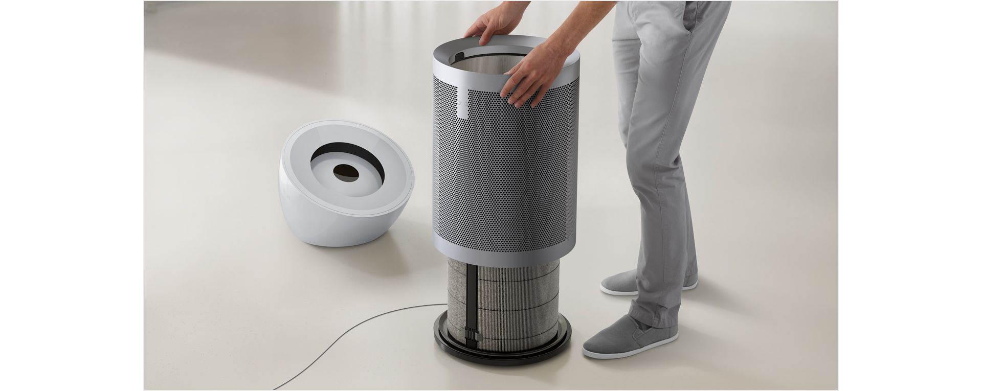 A person opening the Dyson Purifier Big+Quiet to access the filter.