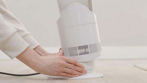 Machine owner tilting the machine to adjust airflow