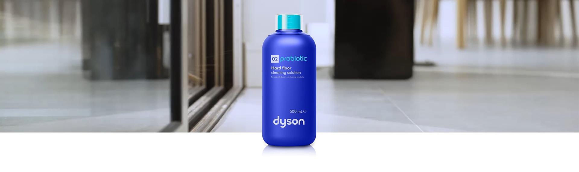 Close up of the roller heads on a Dyson wet cleaner being hydrated with the Dyson 02 Probiotic hard floor cleaning solution.