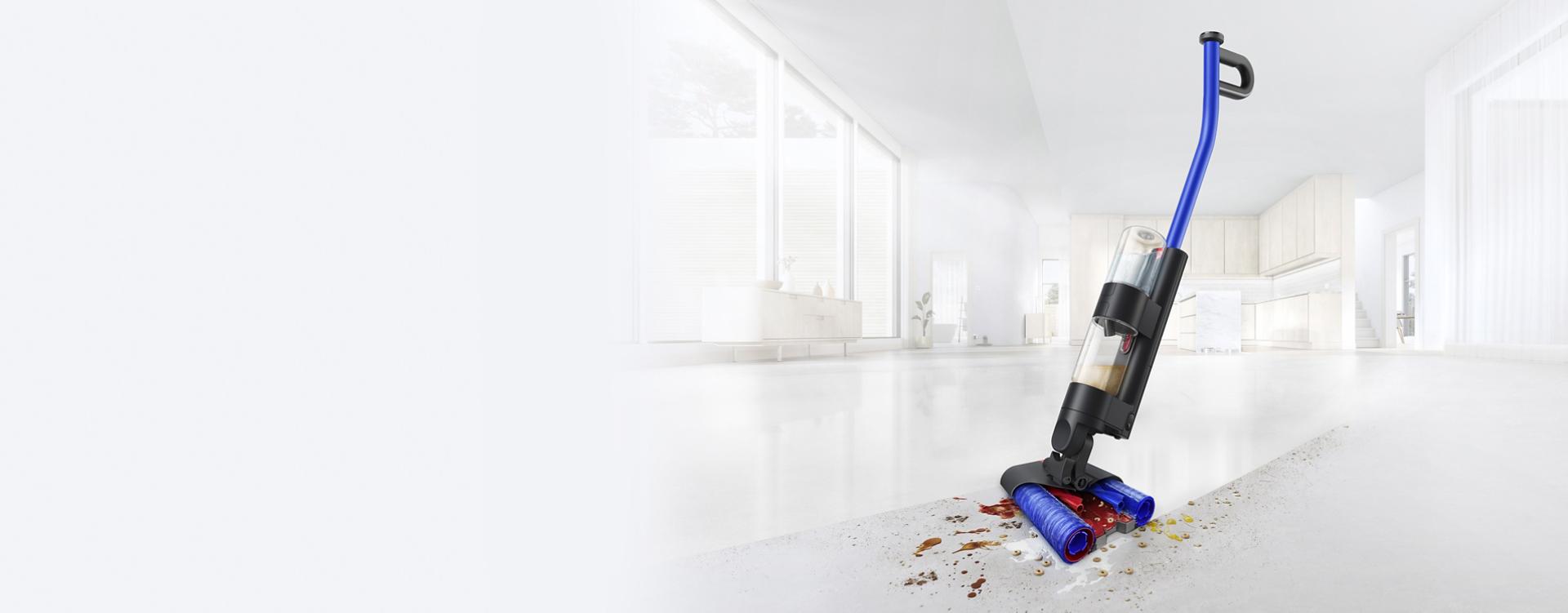 Dyson WashG1 uklízí nepořádek na tvrdé kuchyňské podlaze a zanechává za sebou čistou plochu