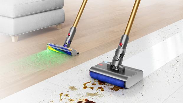 An aerial view of a Dyson wet and dry cleaner removing debris and spills on a tile floor
