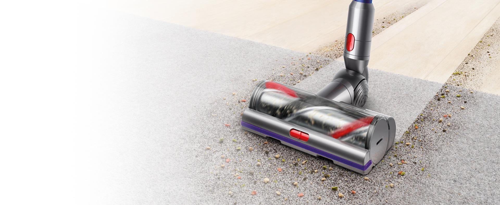 Dyson vacuum motorhead attachment cleaning hard floor then carpet.