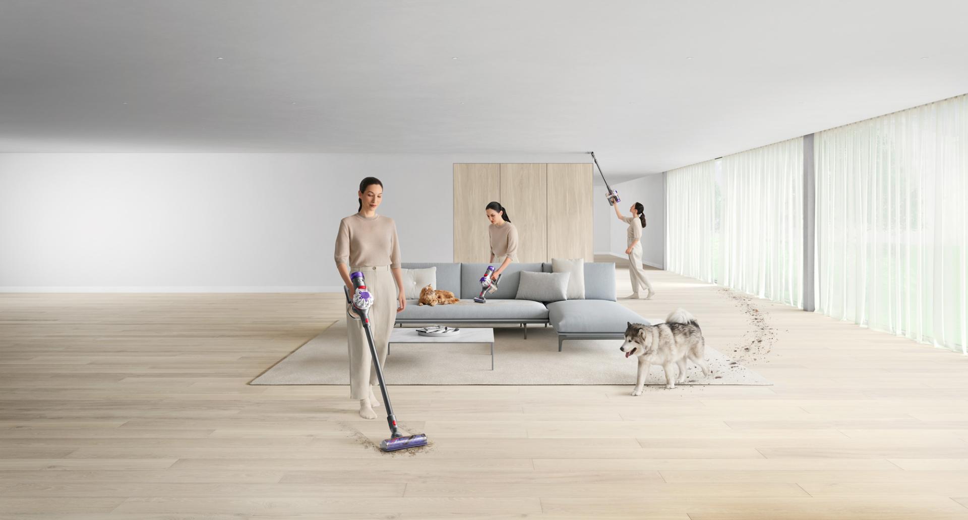 Dyson V8 vacuum cleaning hard floors and a sofa.