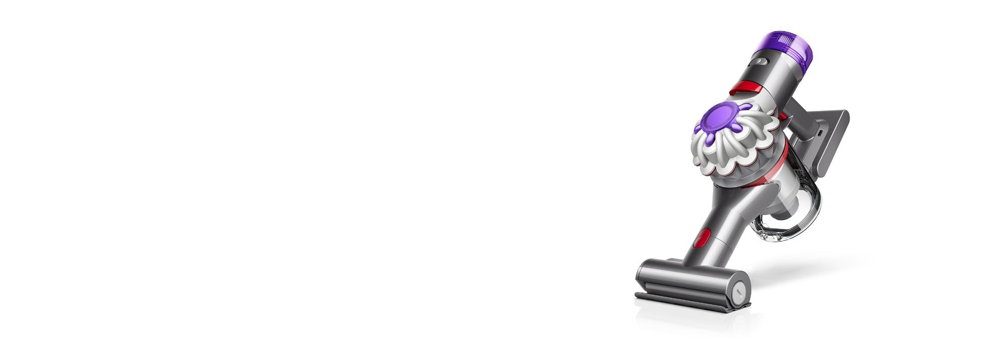 Dyson Car+Boat rokas putekļu sūcējs ar motorizētu miniuzgali uz balta fona.