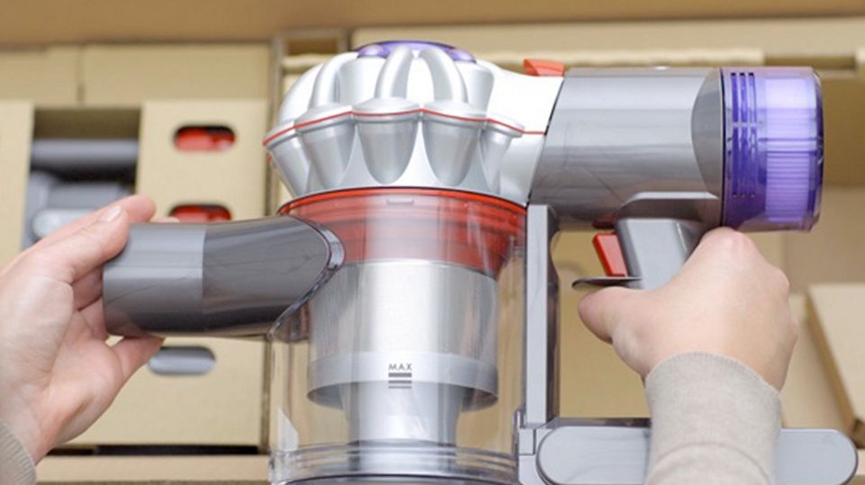 The Dyson V8 Focus being removed from the box.