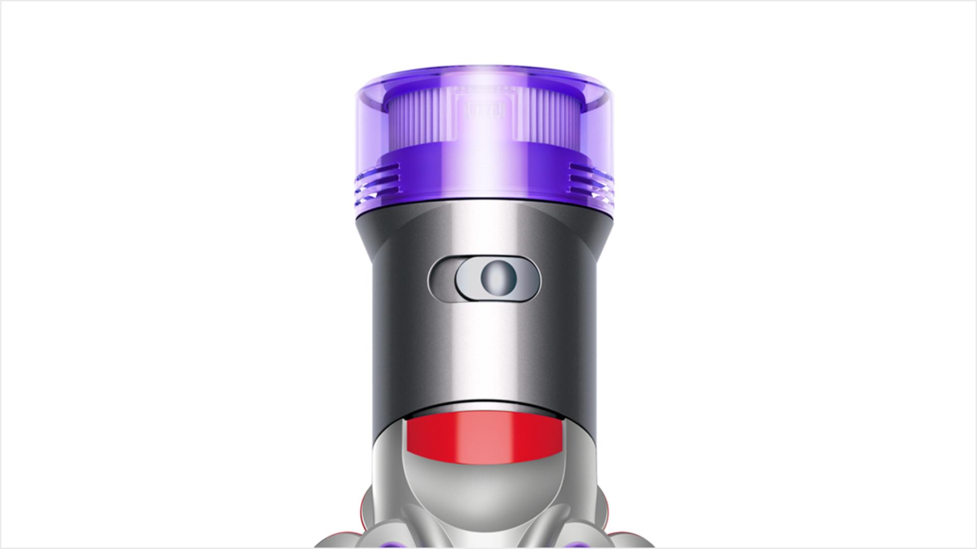 A top view of the Dyson V8 Focus handheld head, focused on the power mode button.
