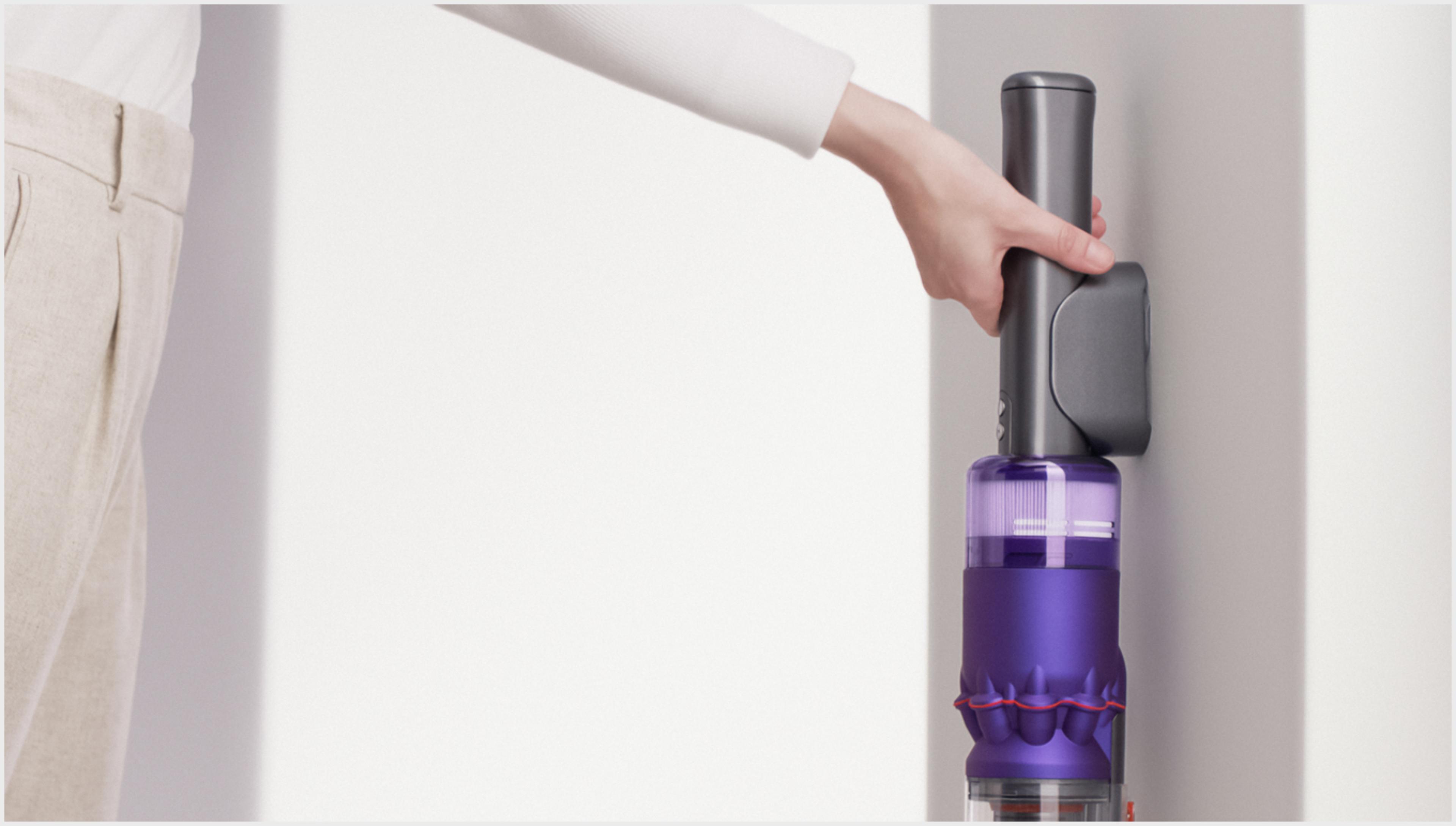 The Dyson Omni-glide vacuum in its wall dock