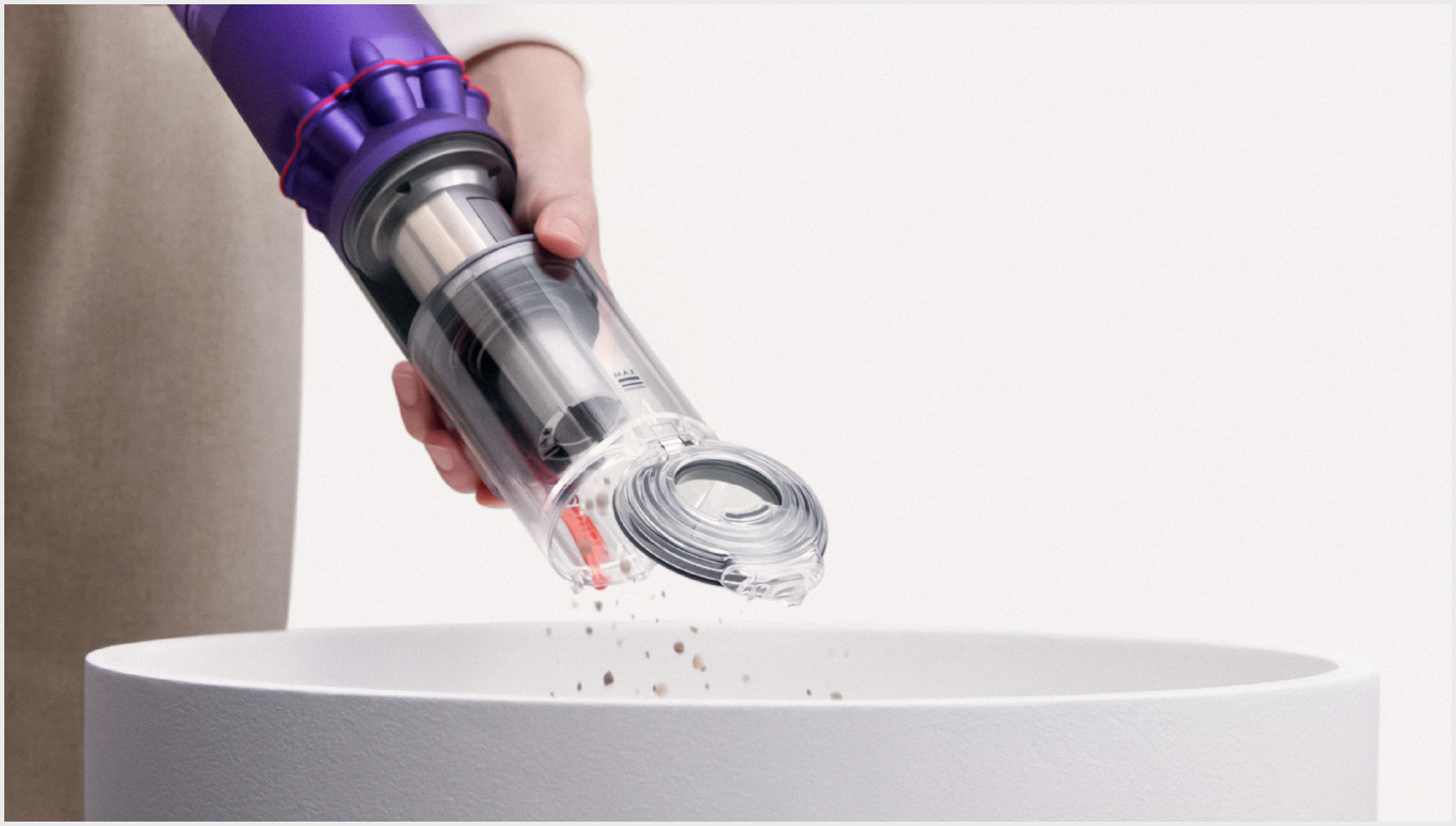 The Dyson Omni-glide vacuum ejecting just into the bin
