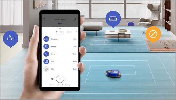 Woman using the MyDyson™ app to control a robot