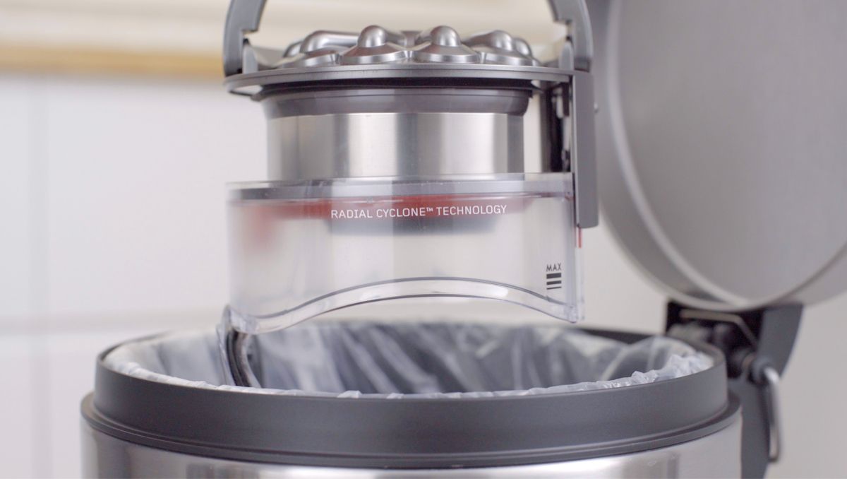 Vacuum bin being emptied