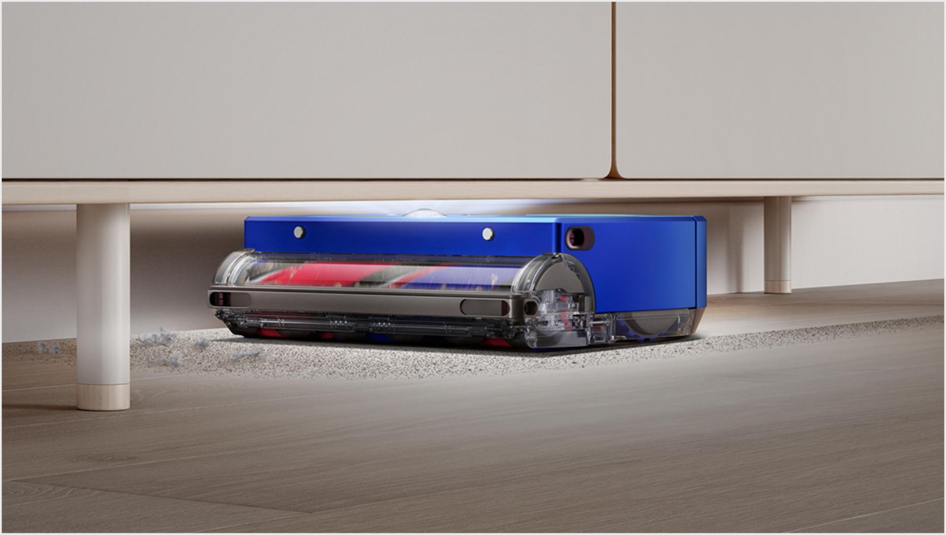 Dyson 360 Vis Nav using its low profile and LED light ring to clean under furniture