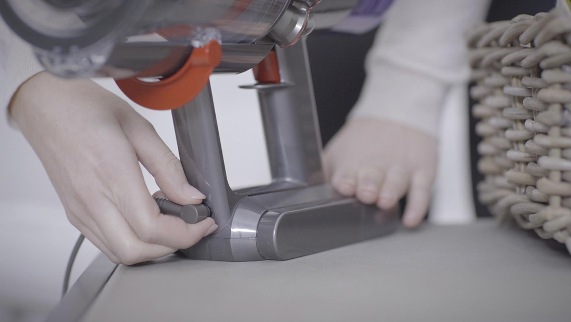 Dyson V11™ vacuum in wall charging dock