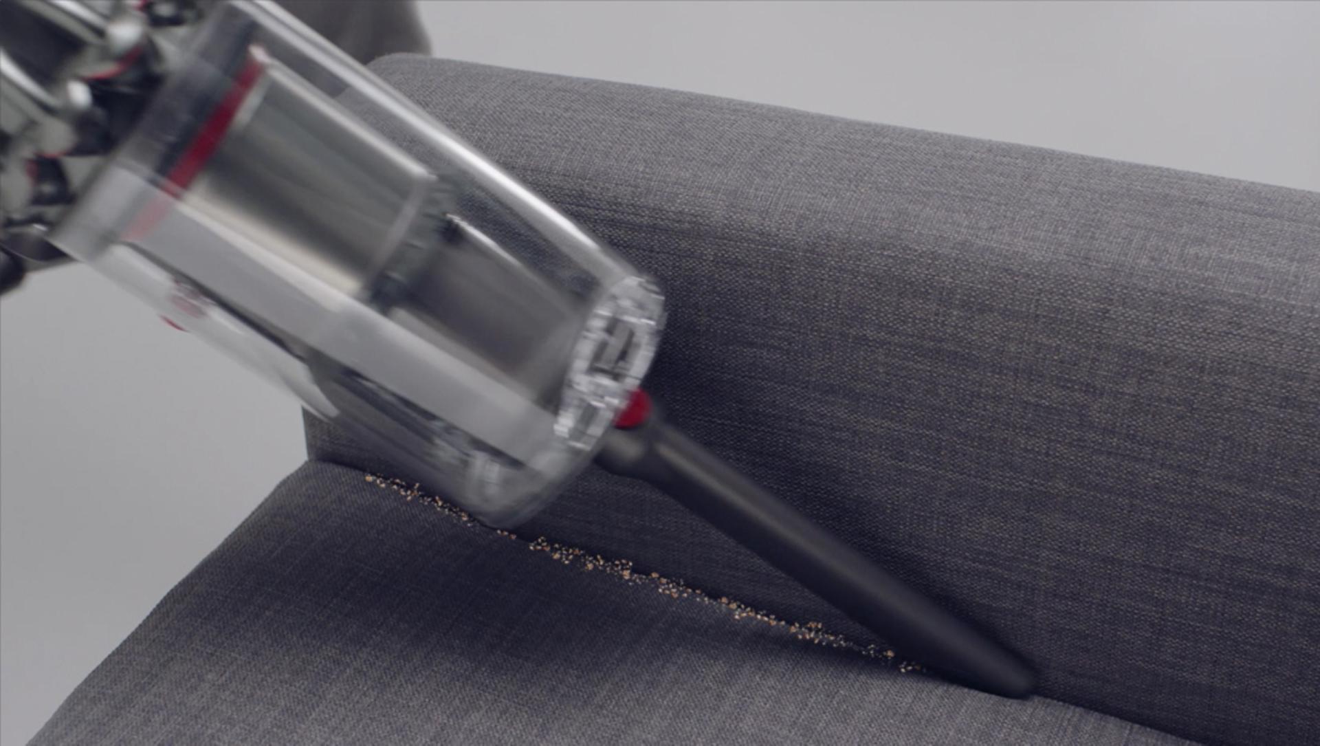 Crevice tool cleaning crevices of a sofa