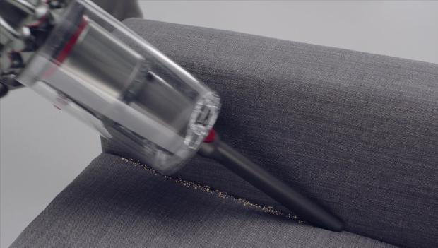 Crevice tool cleaning crevices of a sofa