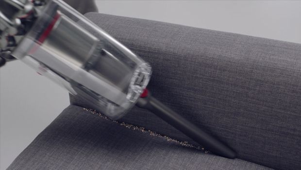 Crevice tool cleaning crevices of a sofa 