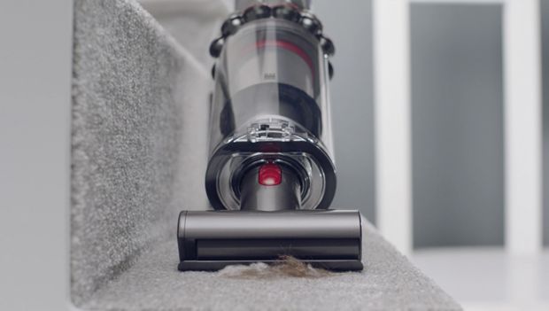 Mini motorised tool cleaning carpet on stairs 