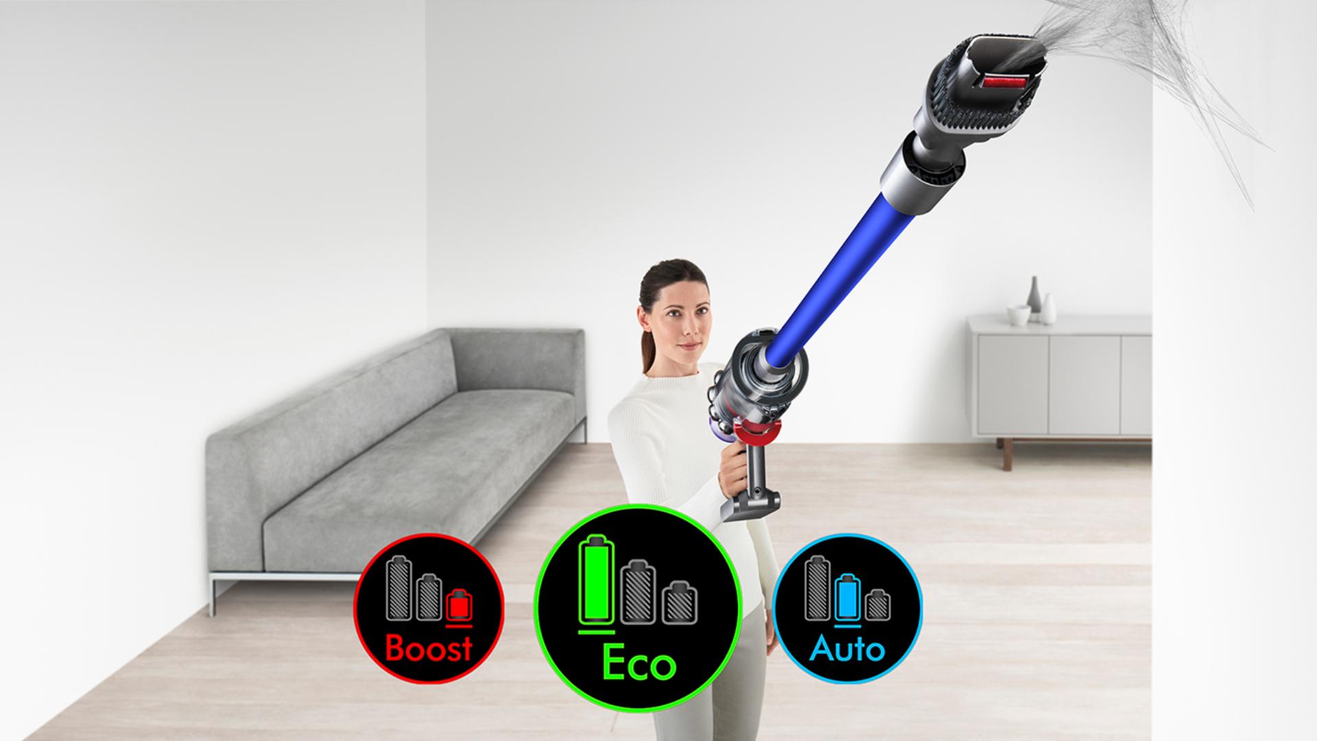 Woman using Dyson V11 vacuum cleaner to clean up high. The three different power mode logos sit in forefront
