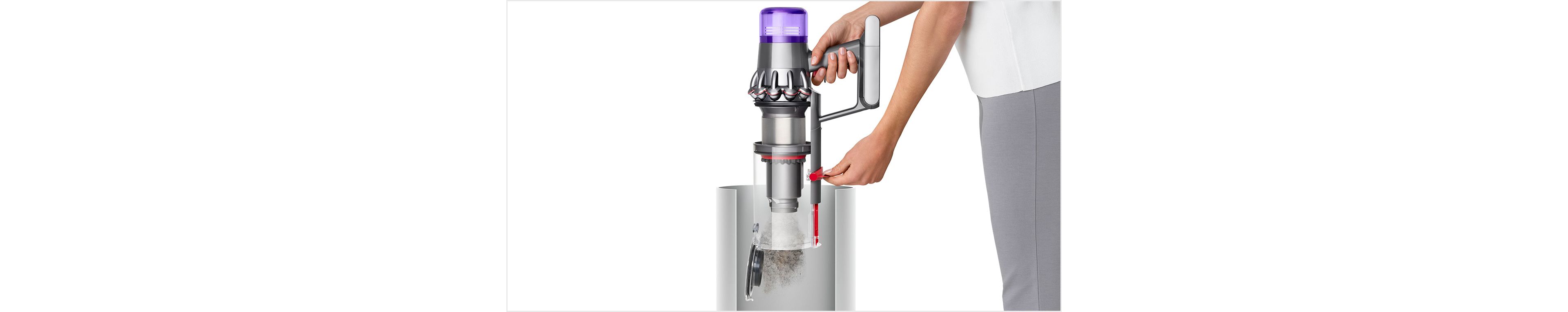 Dyson V11 vacuum cleaner being emptied into a bin