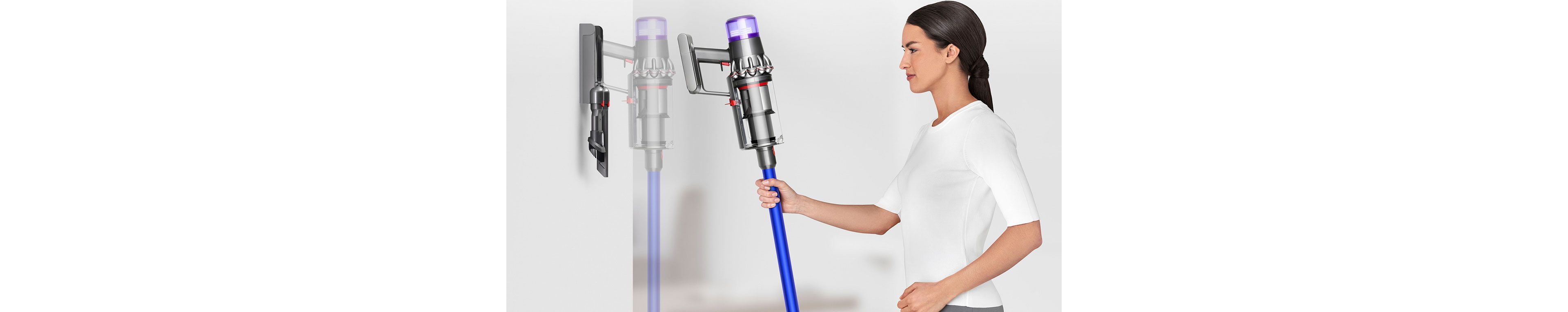 Dyson V11 vacuum cleaner being placed into wall mounted dock
