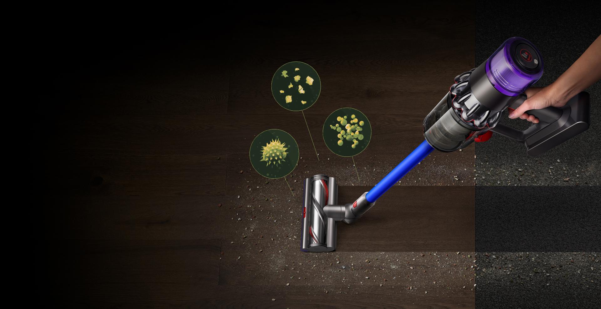 A Dyson V11™ vacuum picking up fine dust, allergens and pollen from the floor.
