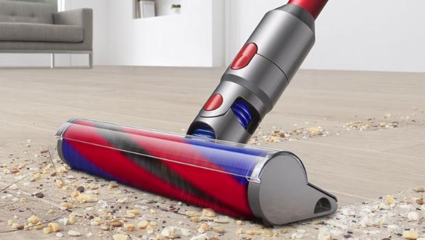 Dyson V8 Slim vacuum cleaning a carpet