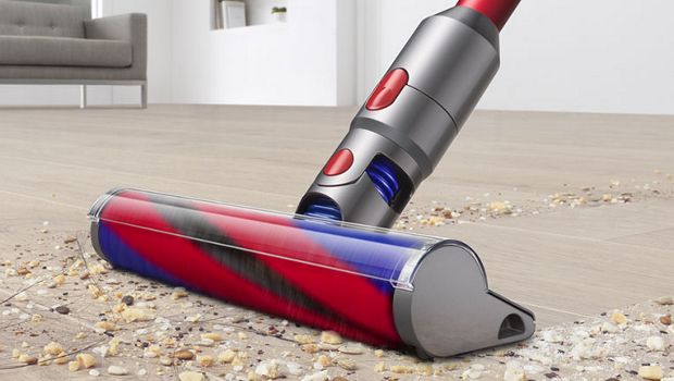 Dyson V8 Slim vacuum cleaning a carpet