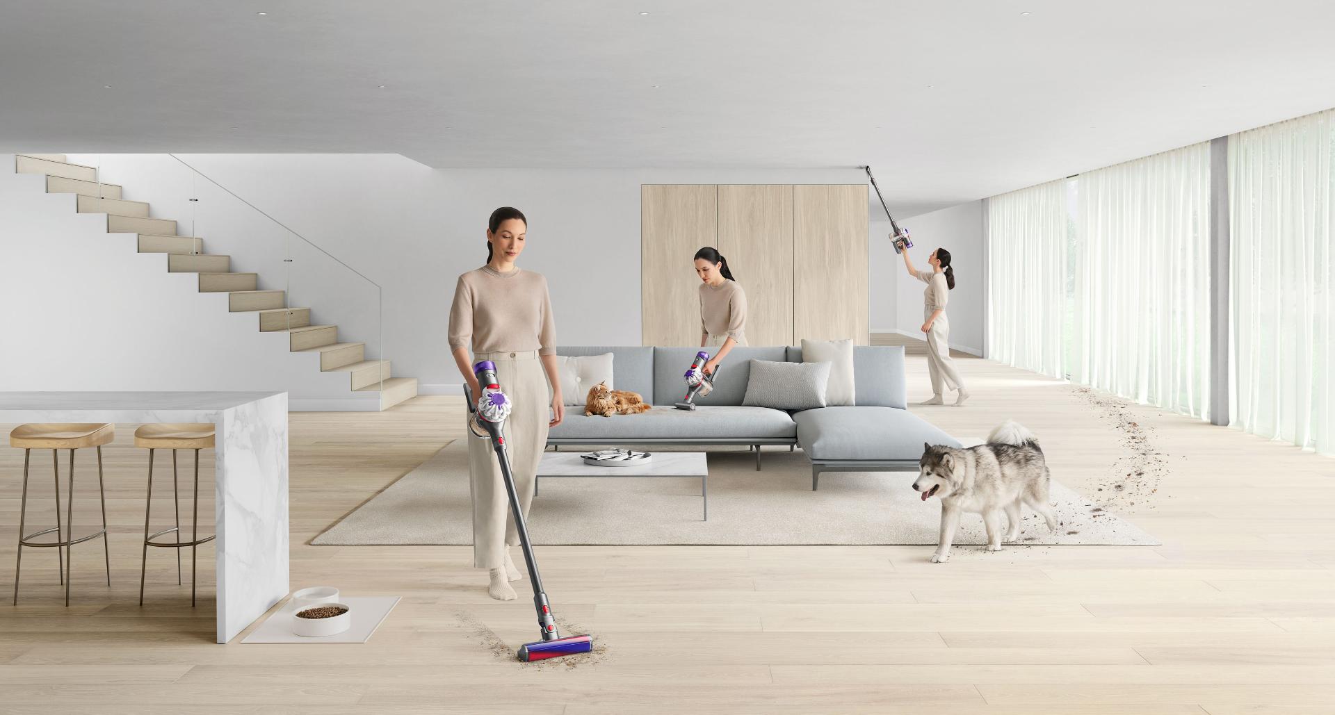 Dyson V8 vacuum cleaning hard floors and a sofa.
