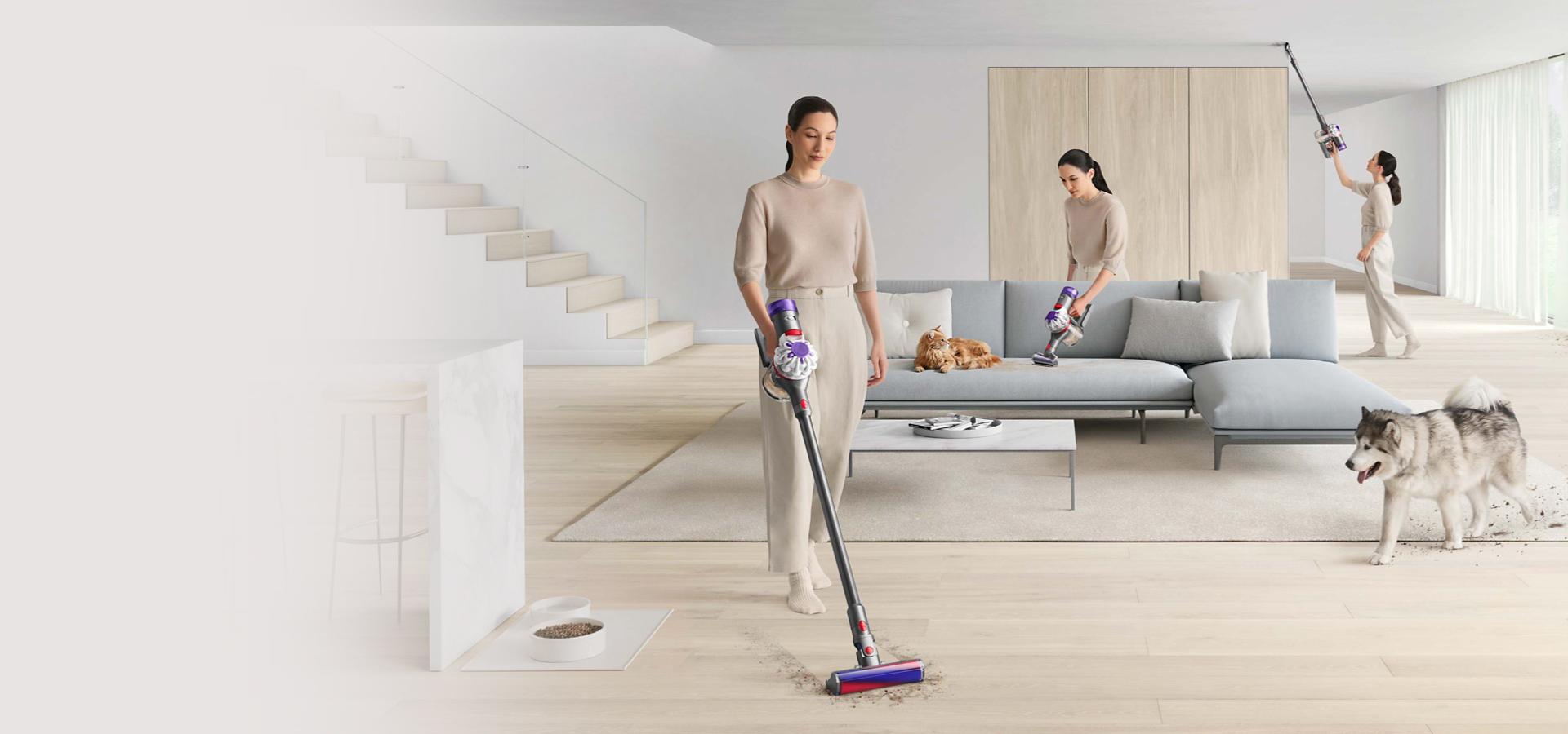 Woman vacuuming around a home with pets