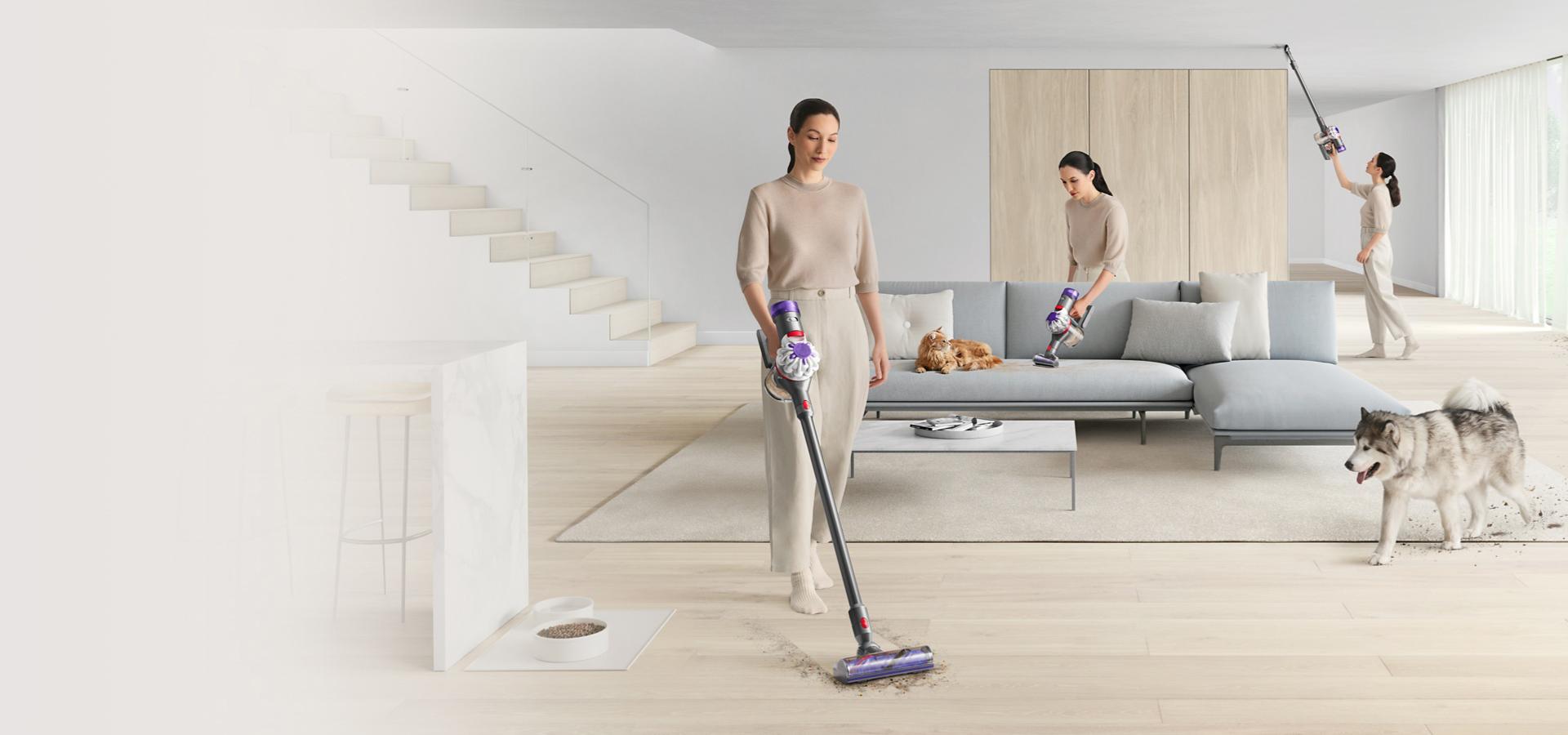 Woman vacuuming carpet with Dyson cord-free V8 vacuum cleaner