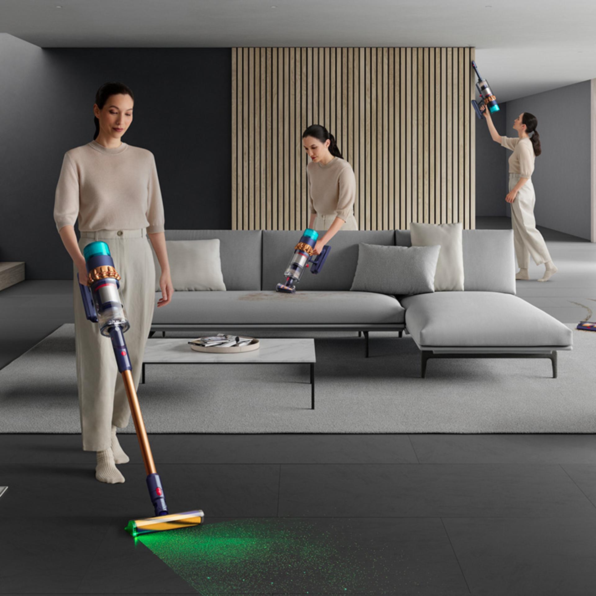 Woman shown using the Dyson Gen5detect as a stick and handheld vacuum around the home.
