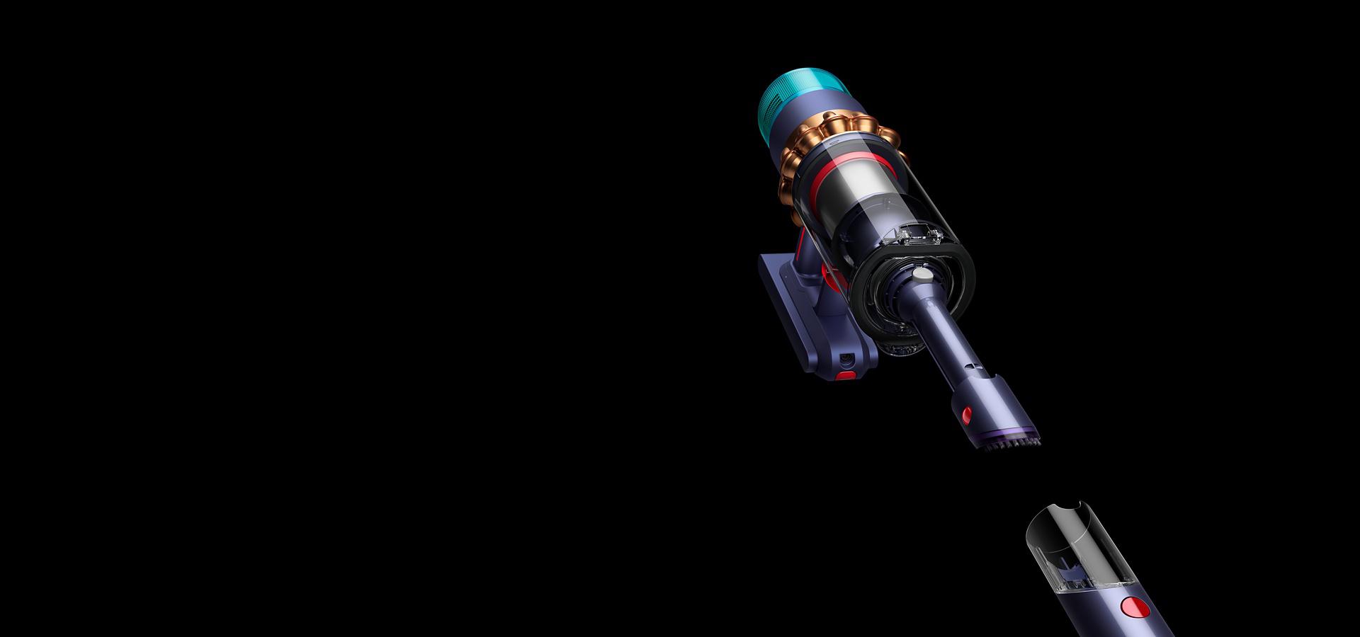 The wand detaching from the handle to reveal the Built-in dusting and crevice tool