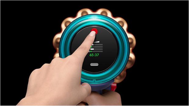 Finger touching the Dyson power button.