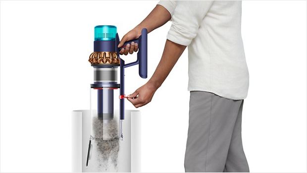 Man emptying the vacuum cleaner bin