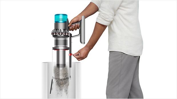 Man emptying the vacuum cleaner bin