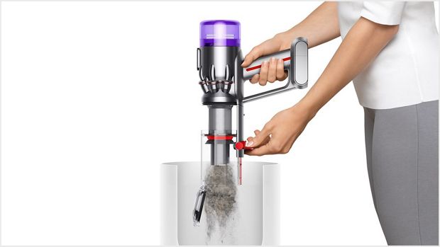 Woman emptying Dyson Micro 1.5kg into the bin