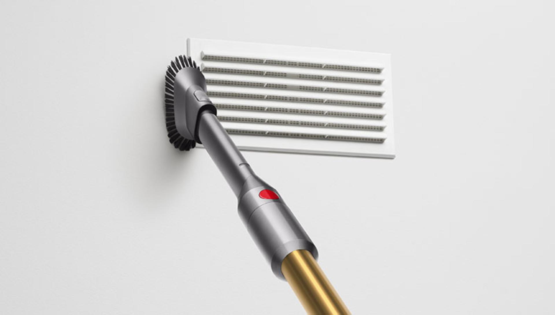 Dyson Micro 1.5kg vacuum cleaning a wall