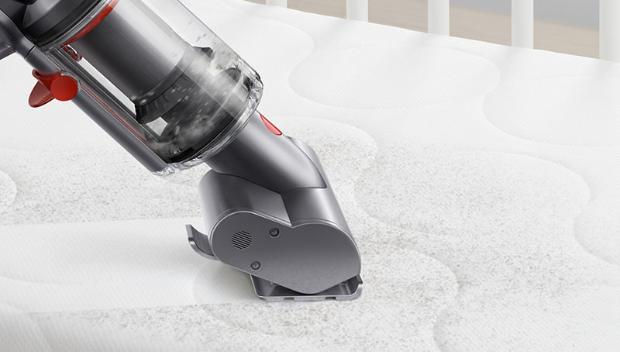 Dyson Micro 1.5kg vacuum cleaning a mattress