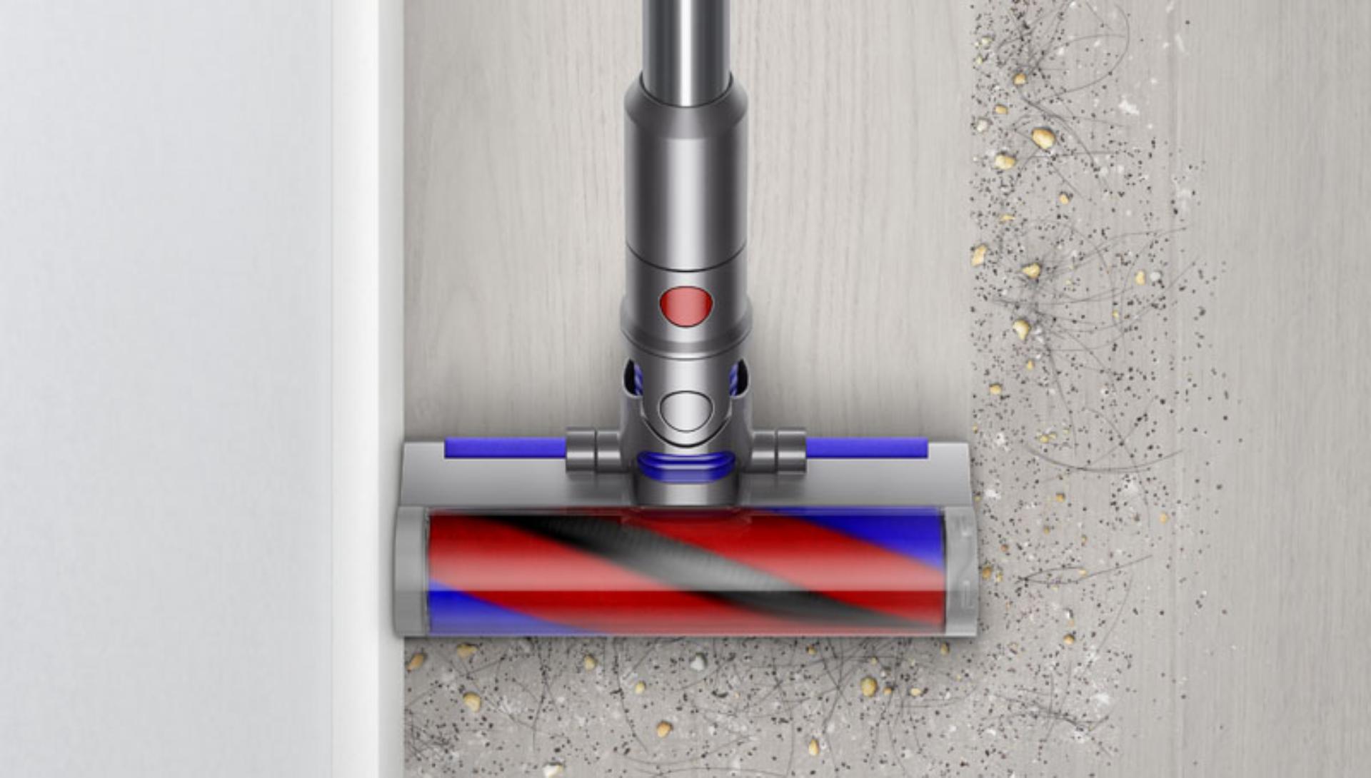 Dyson Micro 1.5kg cleaner head cleaning next to a wall.