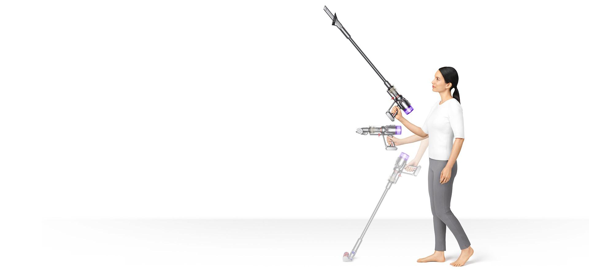 Woman holding Dyson Micro 1.5kg in three different positions.