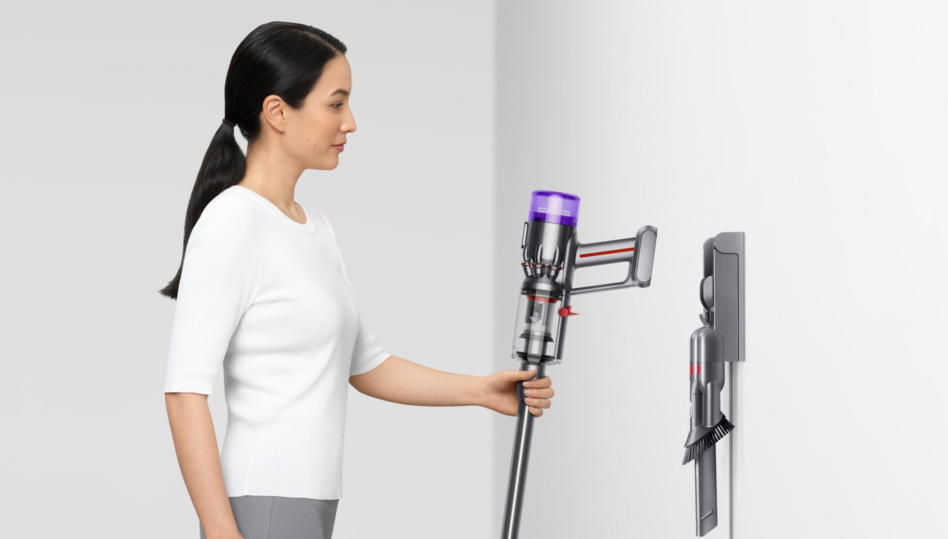 Dyson Micro 1.5kg™ vacuum being placed in the wall dock