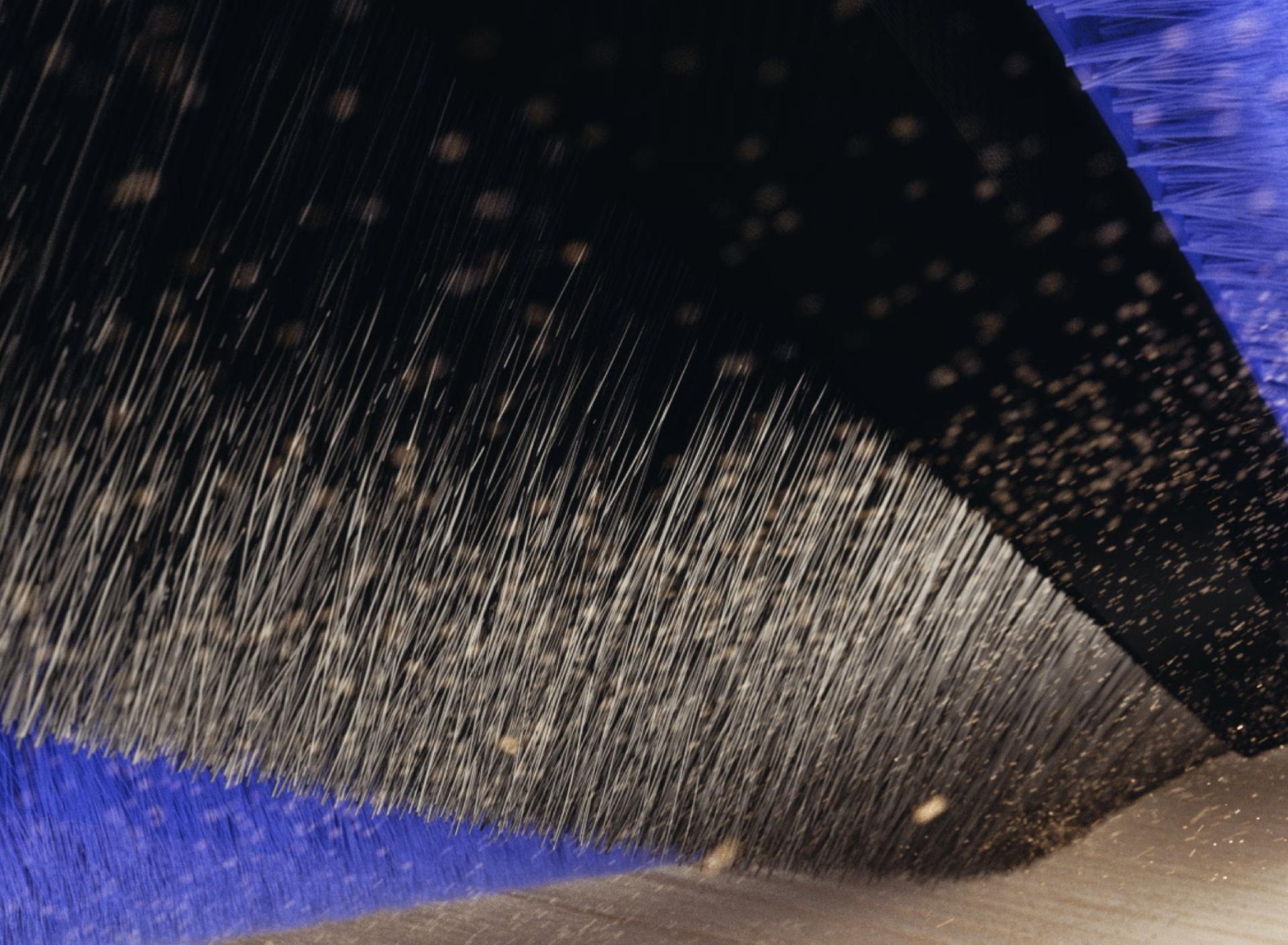 Close-up of black carbon fibre filaments on the brush bar.