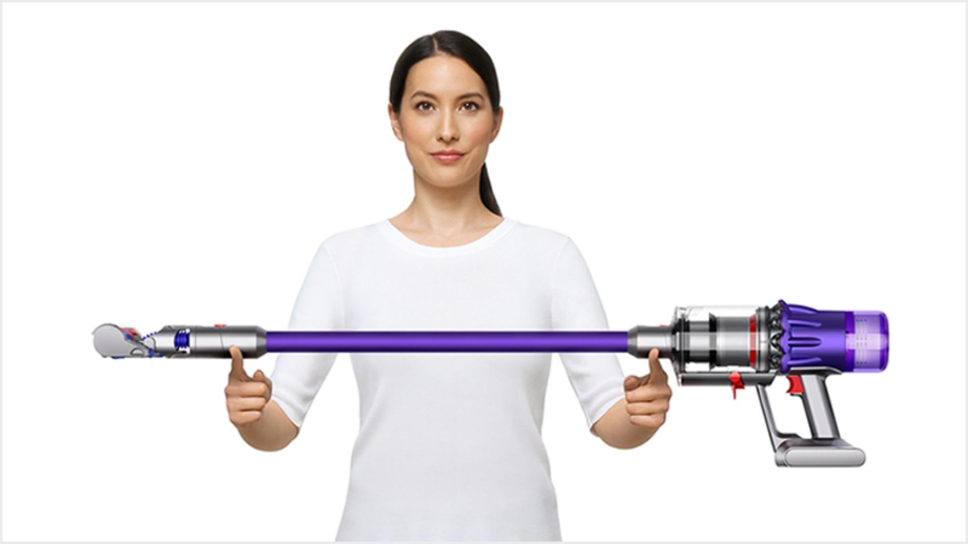 Woman lifting the Dyson Digital Slim vacuum