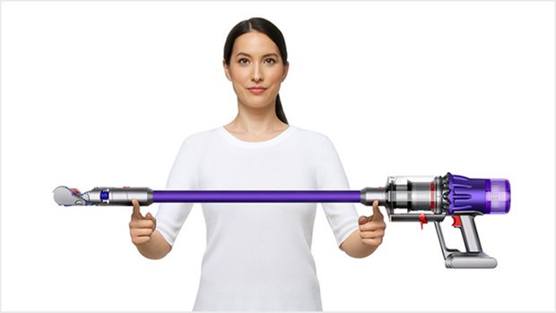Woman lifting the Dyson Digital Slim vacuum