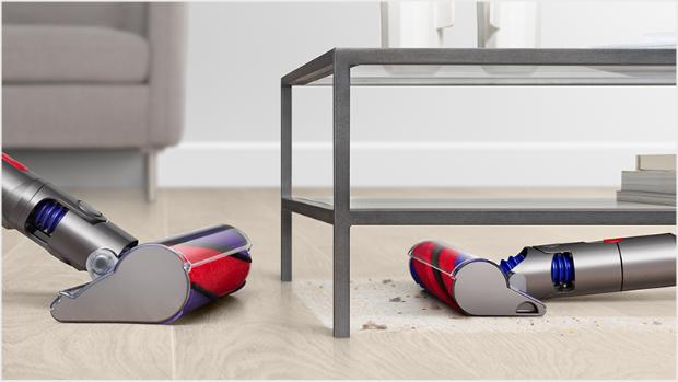 The Slim Fluffy cleaner head under low furniture, compared the standard Fluffy cleaner head
