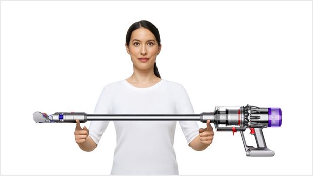 Woman lifting the Dyson Digital Slim vacuum