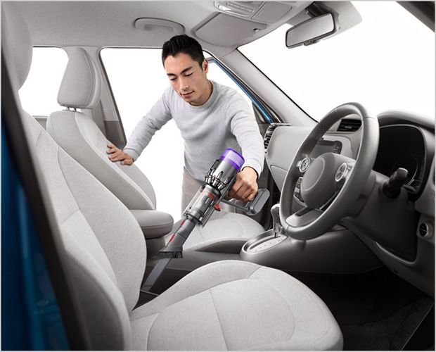 Dyson Micro vacuum cleaning a car.