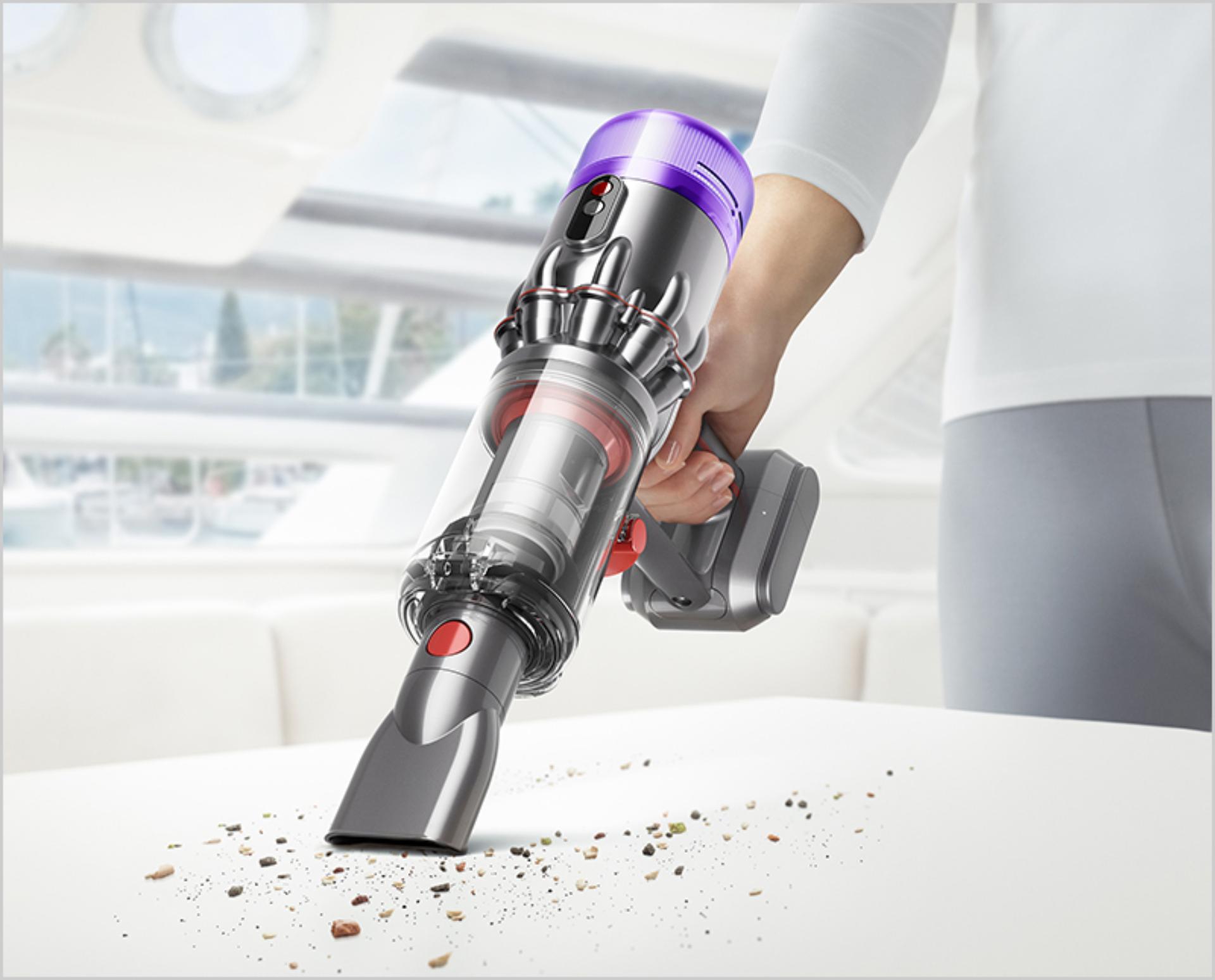Dyson Micro with Worktop tool cleaning crumbs from a kitchen surface.