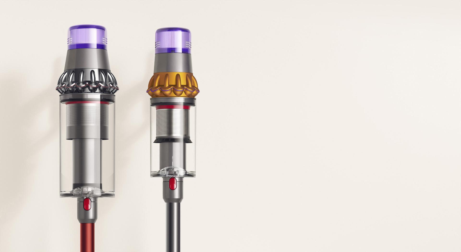 Dyson Outsize vacuum with 150% bigger bin next to a Dyson V11 Absolute vacuum bin