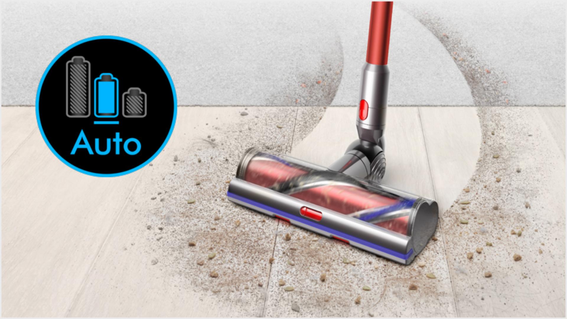 Dyson Outsize vacuum moving as it cleans from a hard floor to carpet.